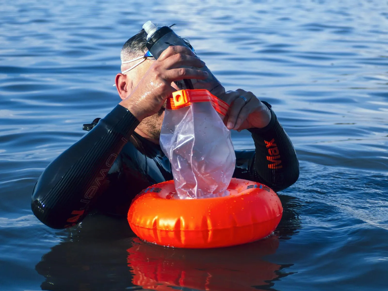 Swim Secure Tow Donut with Integrated Dry Bag- High Visibility Orange